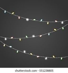 Different color lighting garland vector set on dark background. Christmas lights 
vector collection. Glowing lamps vect or set