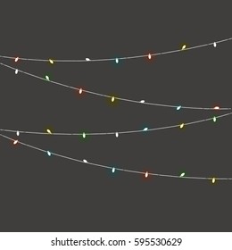 Different color lighting garland vector set on dark background. Christmas lights vector collection. Glowing lamps vect or set