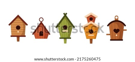 Different colorful birdhouses vector illustrations set. Hobby for children, cute houses or homes for birds on trees with holes of heart or circle shapes on white background. Nature, carpentry concept Сток-фото © 