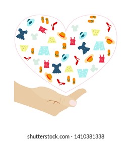 different colorful clothes for donation framed by pink heart under white human cupped hand. cloth donation. small dress, t shirt,  hat and shoes. vector illustration.