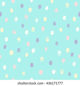 Different colors dots on blue background. Vector hand drawn seamless pattern.