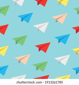 Different colors of realistic flying paper planes in a blue sky. Vector seamless pattern background. Can be used for wallpaper wrapping paper textile fabric prints card or banner template or any else.