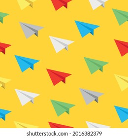 Different colors of realistic flying paper planes on yellow backdrop Vector seamless pattern background Can be used for wallpaper wrapping paper textile fabric prints card or banner template or else