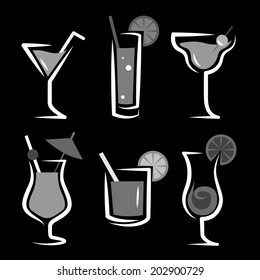 Different kinds of glasses with aperitifs, cocktails, decorated by fruit, grey