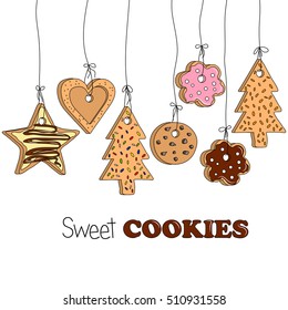 Different kinds of home made cookies hanging on threads