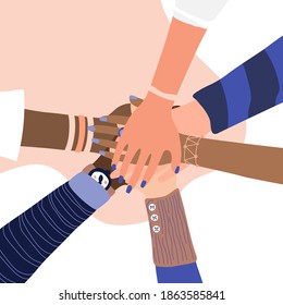 Different people join hands in a fit of teamwork. A group of people strives for a common goal in their work. Together strength, confidence and result. Friendship and helping each other in unity.