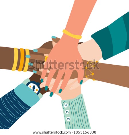 Different people join hands in a fit of teamwork. A group of people strives for a common goal in their work. Together strength, confidence and result. Friendship and helping each other in unity.