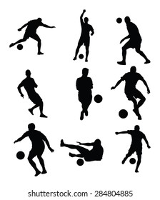 Different poses of soccer players vector silhouette illustration isolated on white background. Football players silhouette.