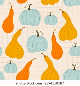 different pumpkins on a checkered background. seamless background with blue and orange pumpkins