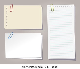 Different sheets of note papers and color paper clips.