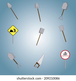 a lot of different shovels, a saw and two traffic signals