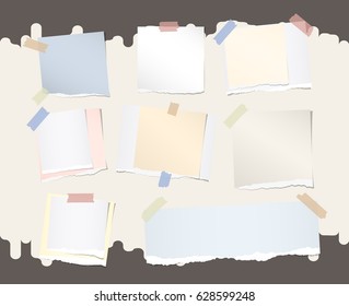 Different size colorful note, notebook, copybook paper stuck with sticky tape on brown background