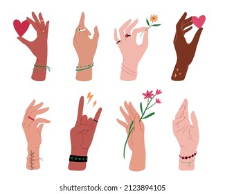 Different skin colors hands collection. Hands with flowers, hearts, bracelets, rings. Human palms, wrists, fists. Different gestures. Vector illustration