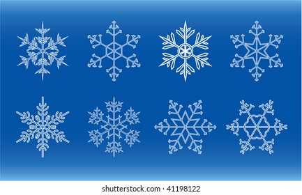 different white snowflakes on blue background