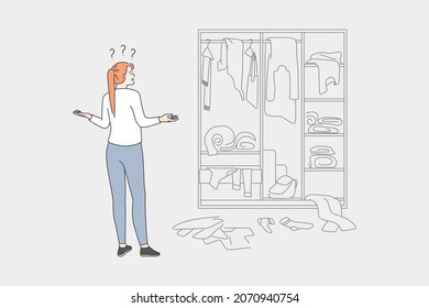 Difficult Choice And Wardrobe Concept. Young Frustrated Woman Cartoon Character Standing Looking At Chaos In Wardrobe Trying To Choose Clothes Vector Illustration 