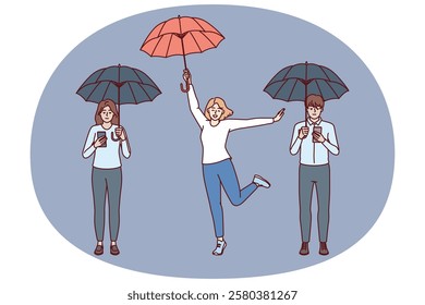 Digital addiction free woman near friends with umbrellas and phones using social media. Concept of combating digital addiction and uncontrolled use of mobile gadgets instead of live communication