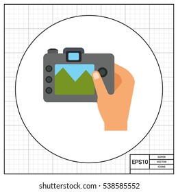 Digital camera in human hand