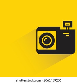 digital camera icon with shadow on yellow background