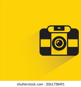 digital camera icon with shadow on yellow background