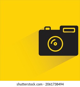 digital camera icon with shadow on yellow background
