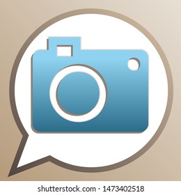 Digital camera sign. Bright cerulean icon in white speech balloon at pale taupe background. Illustration.