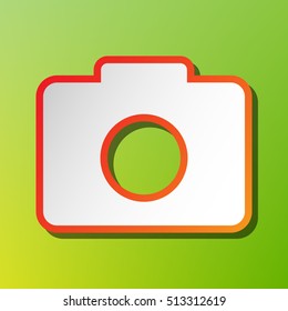 Digital camera sign. Contrast icon with reddish stroke on green backgound.