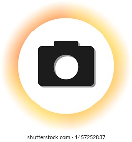 Digital camera sign. Dark icon with shadow on the glowing circle button. Illustration.