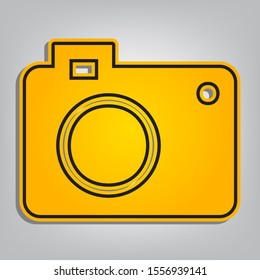 Digital camera sign. Flat orange icon with overlapping linear black icon with gray shadow at whitish background. Illustration.
