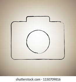 Digital camera sign. Vector. Brush drawed black icon at light brown background.