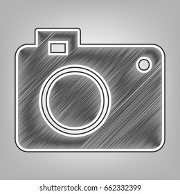 Digital camera sign. Vector. Pencil sketch imitation. Dark gray scribble icon with dark gray outer contour at gray background.