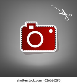 Digital camera sign. Vector. Red icon with for applique from paper with shadow on gray background with scissors.