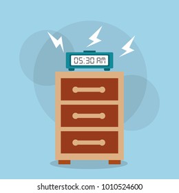 digital clock alarm on bedside table