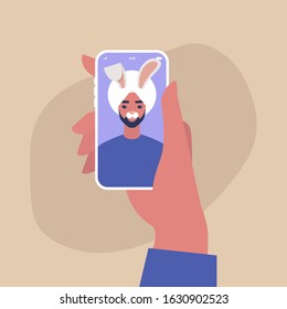 Digital face application, young indian male character wearing a bunny mask, millennial lifestyle