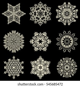 Digital hand drawn of element in the clean, whimsical and modern surface on black background in beige colors. Vector snowflakes and christmas winter set.
