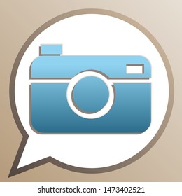 Digital photo camera sign. Bright cerulean icon in white speech balloon at pale taupe background. Illustration.