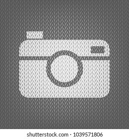 Digital photo camera sign. Vector. White knitted icon on gray knitted background. Isolated.