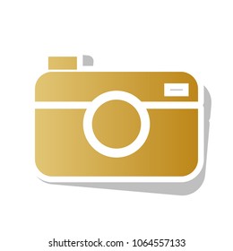 Digital photo camera sign. Vector. Golden gradient icon with white contour and rotated gray shadow at white background.