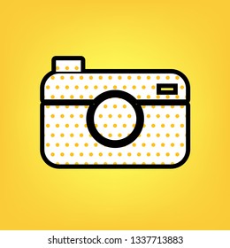 Digital photo camera sign. Vector. Yellow polka dot white icon with black contour at warm yellow background.