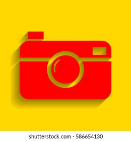 Digital photo camera sign. Vector. Red icon with soft shadow on golden background.