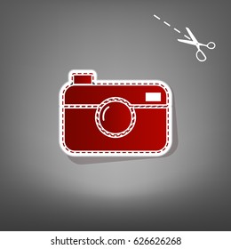 Digital photo camera sign. Vector. Red icon with for applique from paper with shadow on gray background with scissors.