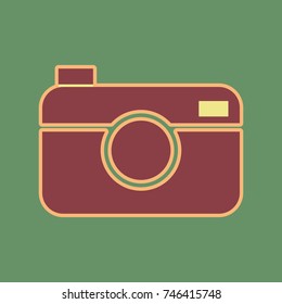 Digital photo camera sign. Vector. Cordovan icon and mellow apricot halo with light khaki filled space at russian green background.