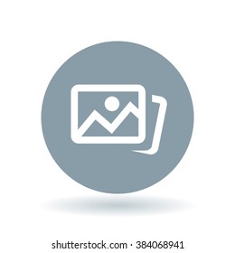 Digital photos icon. Photo album sign. Image gallery symbol. White icon on cool grey circle background. Vector illustration.