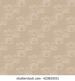Digital SLR camera on a brown background seamless pattern