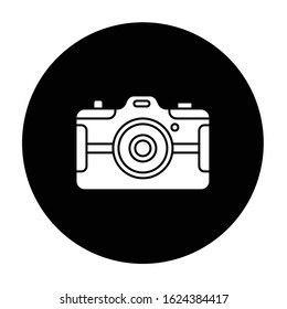 Digital still camera glyph icon. Photography tool. Portable recording gadget. Photoshoot. Technology. Handheld electronic mobile device. Vector white silhouette illustration in black circle