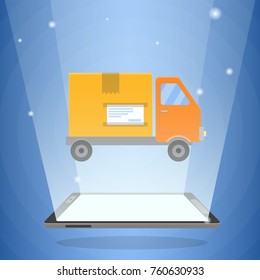 Digital tablet computer and delivery truck with cardboard box on it. Delivery service app, Internet shopping, logistic or postal service concept