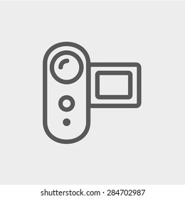 Digital video camera icon thin line for web and mobile, modern minimalistic flat design. Vector dark grey icon on light grey background.