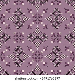 Digitally created motif of floral patterns and geometric shapes on pink background Navajo tribal vector seamless pattern. Native American ornament. Ethnic South Western decor style. Boho geometric 
