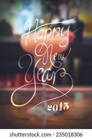 Digitally generated New years message against blurred cocktail