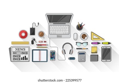 Digitally generated Overhead of desk with stationery and technology 
