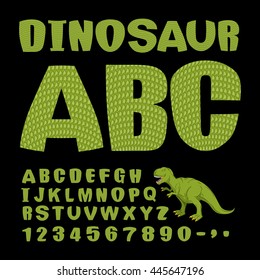 Dinosaur ABC. Font of prehistoric reptile. Green letters. Texture of skin of lizard. Dino Monster alphabet. Set of ancient animals type